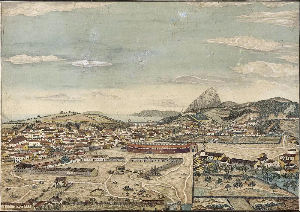 Cidade histórica com casas, navio e colina.