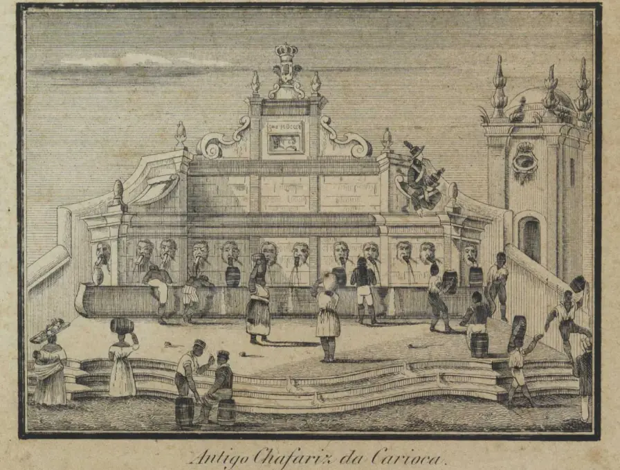 Chafariz antigo em Carioca com pessoas e torre ornamentada.