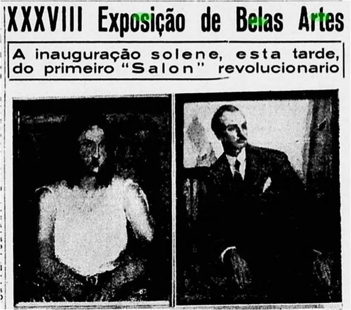 Dois indivíduos em exposição de belas artes, um sentado e outro de pé.