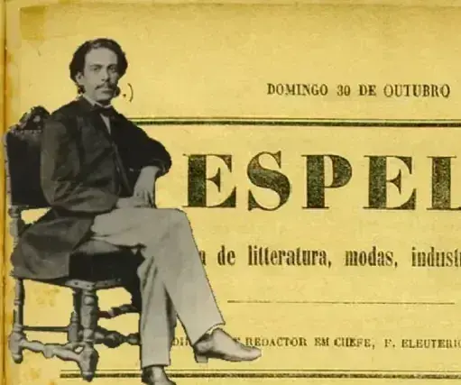 Homem em terno clássico, sentado em cadeira ornamentada, data: Domingo 30 de Outubro.