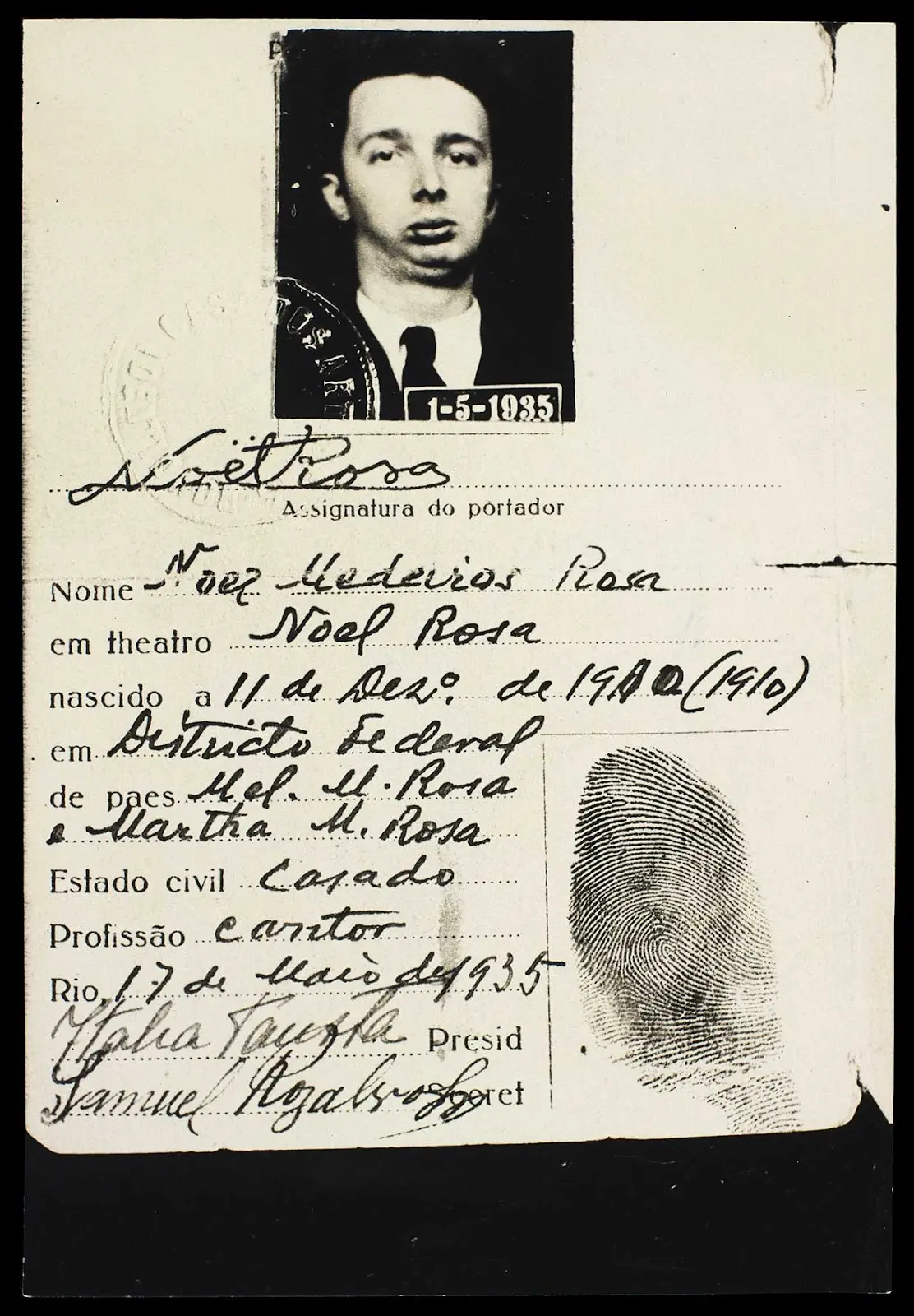 Cartão de identidade preenchido com dados pessoais e assinaturas.