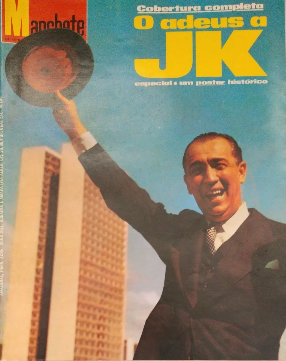 Capa de revista "Manchete" com homem sorrindo e chapéu, edifício moderno ao fundo, céu azul claro.